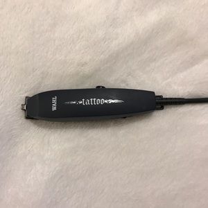 Wahl Tattoo Trimmer fine blades for detailed cuts.